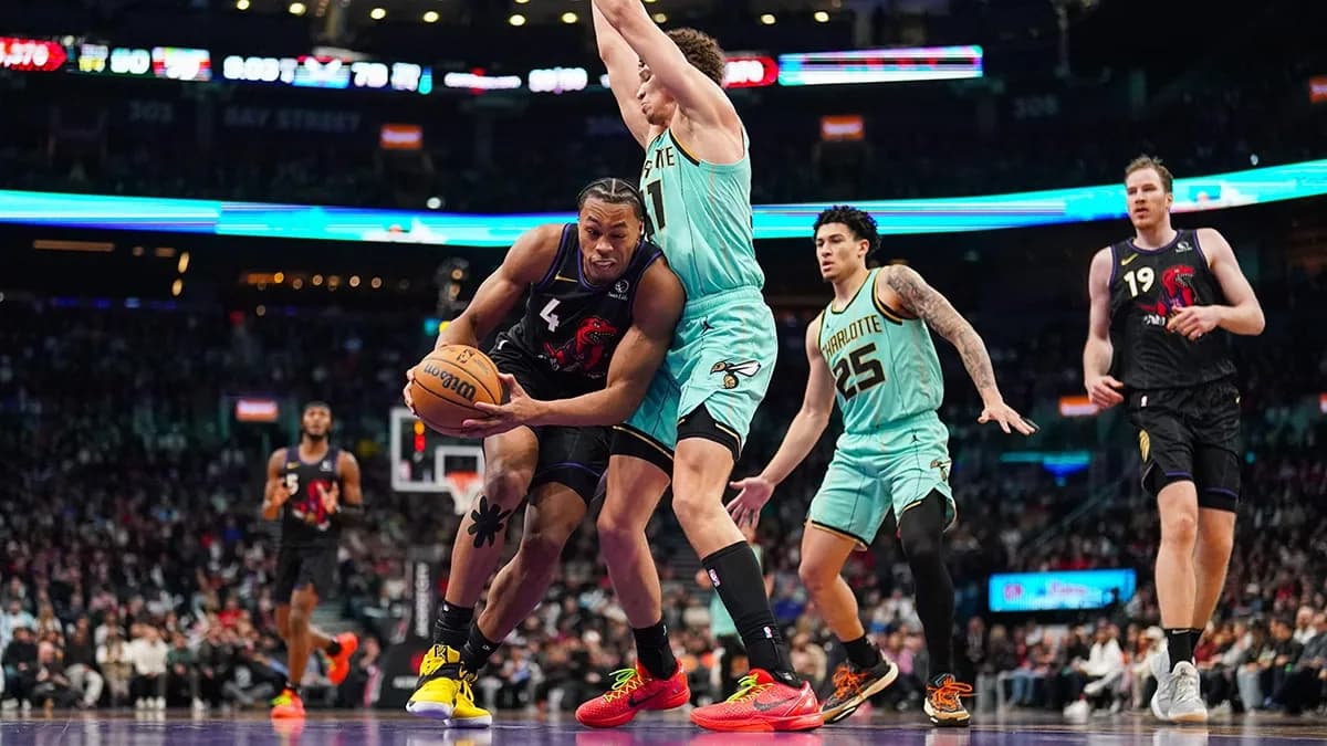 NBA-style basketball arena during a live game with court-side sports sponsorship visibility - World Sports Advertising