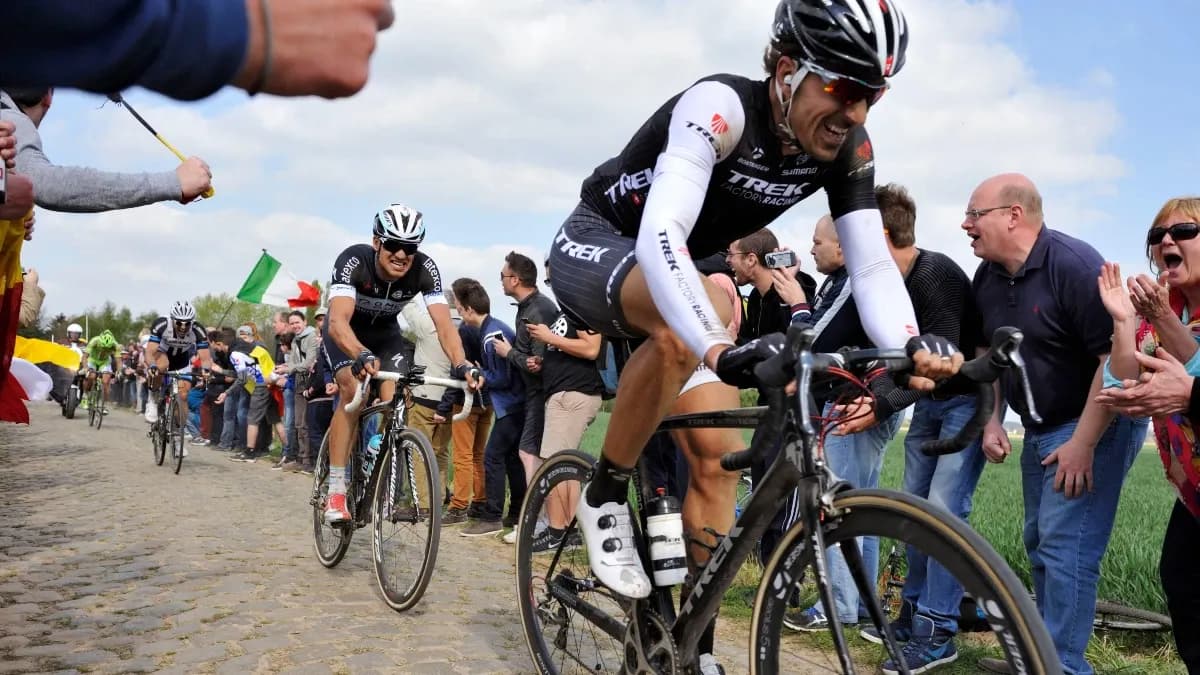 Paris-Roubaix cobbled cycling classic with roadside sports advertising and team branding - World Sports Advertising