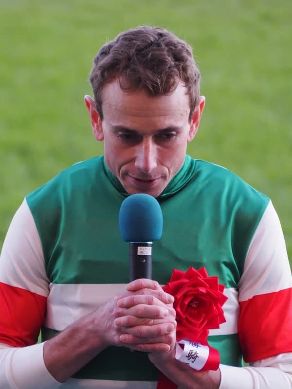 Ryan Moore in elite horse racing action as a sports brand ambassador for World Sports Advertising