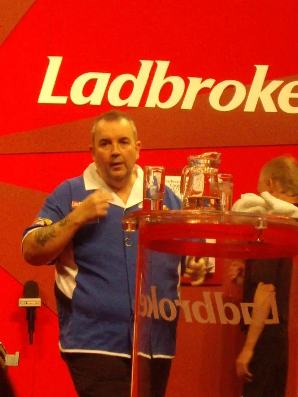 Phil Taylor in elite darts action as a sports brand ambassador for World Sports Advertising